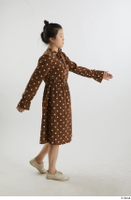    Aera  1 brown dots dress casual dressed side view walking white oxford shoes whole body 0002.jpg